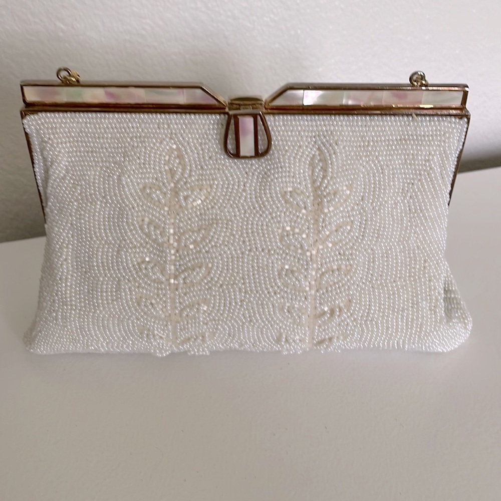 Vintage white beaded purse with mother of pearl clasp and silk lining.